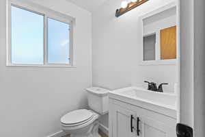 Bathroom with vanity and toilet