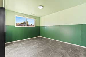 Unfurnished room with baseboards