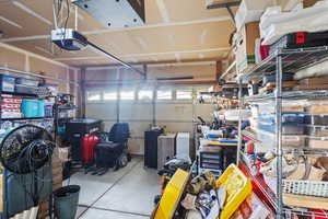 Garage featuring a garage door opener