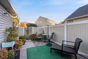 Fenced backyard with a patio