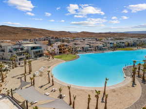 View of pool with a residential view and a mountain view