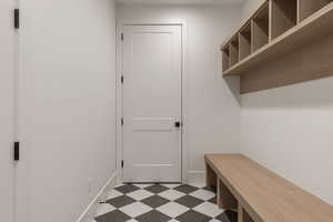 Mudroom with dark flooring