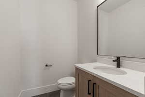 Bathroom featuring vanity and baseboards
