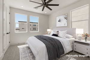 Bedroom with carpet flooring, a ceiling fan, and recessed lighting