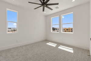 Empty room with carpet flooring, recessed lighting, and a ceiling fan