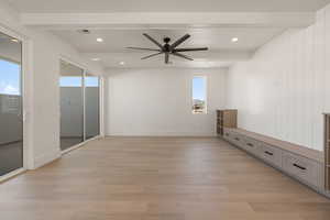 Spare room featuring beam ceiling, light wood-style floors, ceiling fan, and recessed lighting