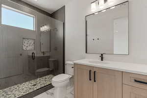 Full bathroom with vanity, a stall shower, and light marble finish flooring