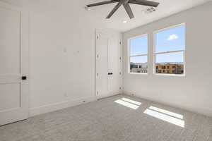Unfurnished bedroom featuring carpet, a ceiling fan, a closet, and recessed lighting