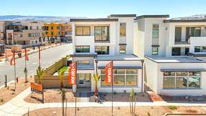 View of building exterior with a mountain view and a residential view