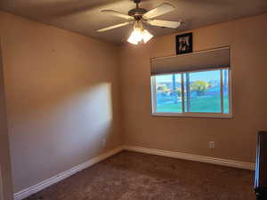 Unfurnished room with carpet flooring and ceiling fan