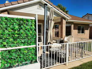 Doorway to property featuring brick siding