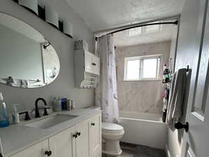 Tastefully updated full bath with white vanity, shower/soaking tub combo