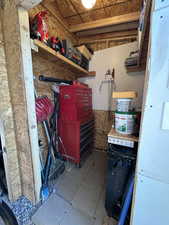 View of storage/workshop area in garage