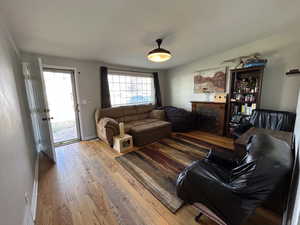 Living area featuring wood flooring