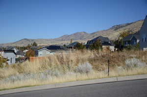 View of mountain background featuring nearby suburban area