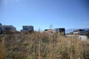 View of yard with a mountain view and a residential view
