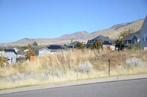 View of mountain background featuring nearby suburban area