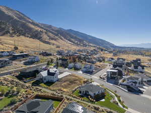 Aerial view of residential area featuring a mountainous background