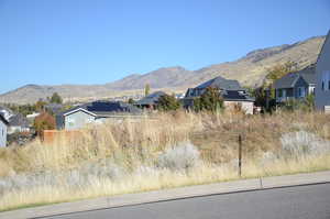 Mountain view featuring nearby suburban area