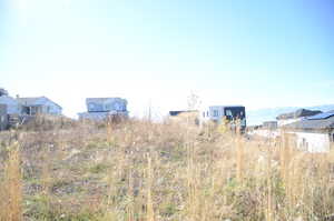 Water view with nearby suburban area and mountains
