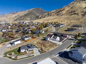 Aerial view of residential area featuring a mountain backdrop