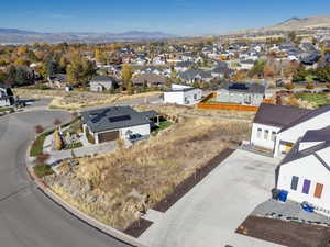 Aerial perspective of suburban area with a mountain backdrop