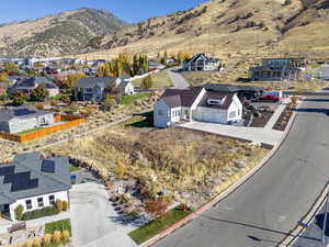 Aerial perspective of suburban area with a mountain backdrop