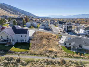 Aerial view of residential area featuring a mountainous background