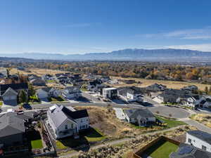 Aerial view of residential area featuring a mountainous background