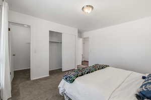 Bedroom with carpet floors and a closet