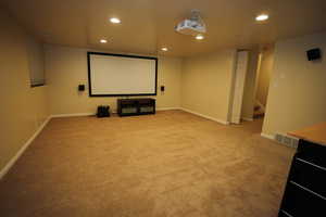 Home theater featuring recessed lighting and light carpet