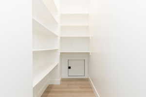 View of pantry area in kitchen with door for easy unloading from garage