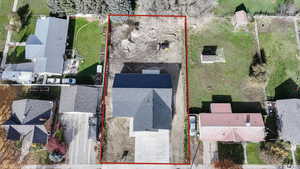 Aerial perspective of suburban area featuring property parcel outlined