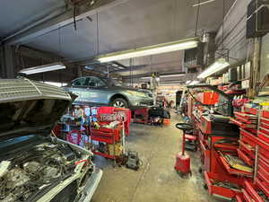 Garage featuring a heating unit