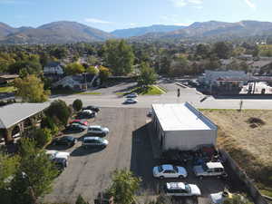 Aerial perspective of suburban area featuring a mountain backdrop