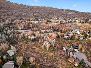 Aerial view of property's location featuring nearby suburban area