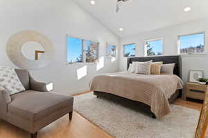 Master Bedroom featuring vaulted ceiling, wood finished floors, recessed lighting, and ceiling fan