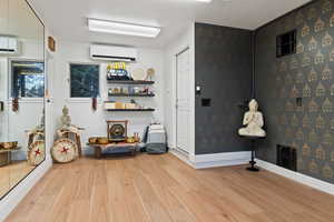 Yoga Studio & Wellness Retreat with light wood-type flooring.