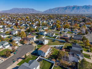 Aerial perspective of suburban area featuring a mountain backdrop