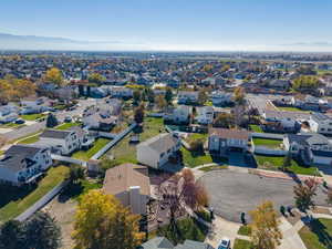 Aerial view of residential area featuring a mountain backdrop
