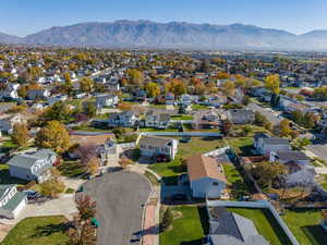 Aerial perspective of suburban area featuring a mountainous background