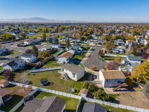 Aerial perspective of suburban area featuring a mountain backdrop