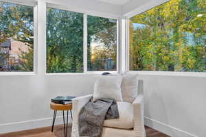 Sitting room featuring baseboards and wood finished floors