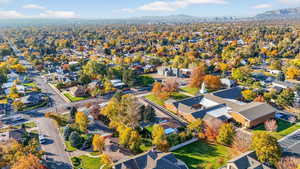 Aerial perspective of suburban area featuring a mountainous background