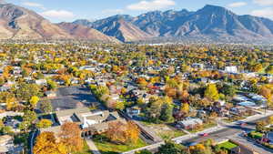 Aerial perspective of suburban area featuring a mountain backdrop