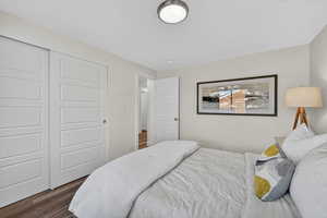 Bedroom featuring a closet and wood finished floors