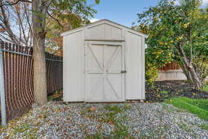 View of shed featuring a fenced backyard