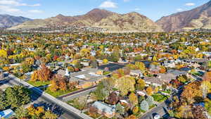 View of property location featuring a mountainous background and nearby suburban area