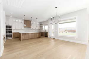 Kitchen with glass insert cabinets, open shelves, decorative backsplash, light wood finished floors, and recessed lighting