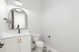Bathroom with vanity and toilet